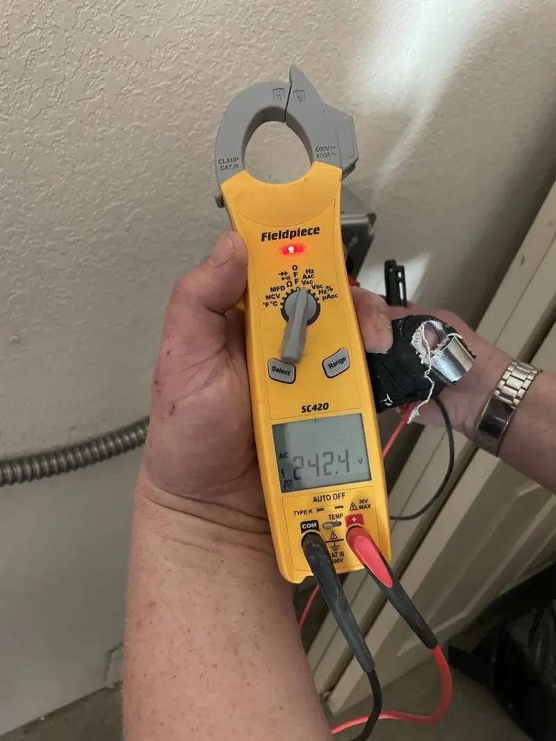 Voltage testing with clamp meter during Outlet Installation in Palmetto